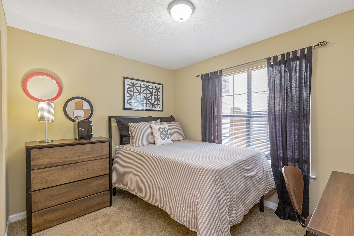 Bright and airy bedroom with large windows.