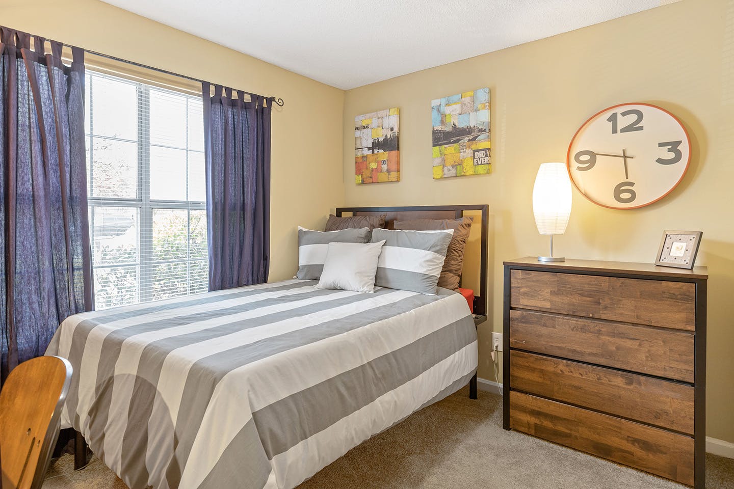 Spacious bedroom with a study area.